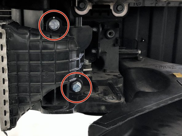 Remove the two 12mm bolts that attach the OEM intercooler to the OEM cold pipe using a 12mm socket and ratchet