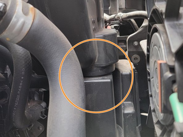 Wiggle the airbox and pull it up at the same time to loosen the airbox from the lower sound dampener