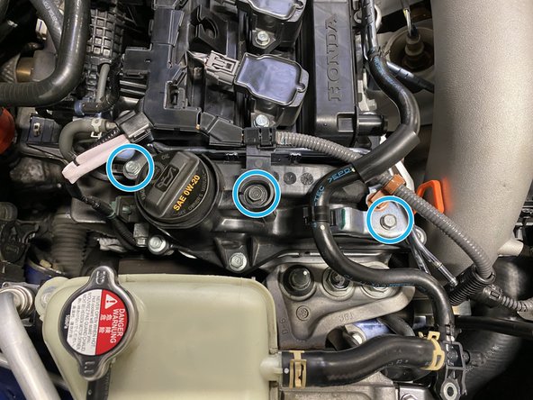 Using the closed end of a box-end wrench, thread the metal pipe through the close end then use the wrench to bend the metal pipe