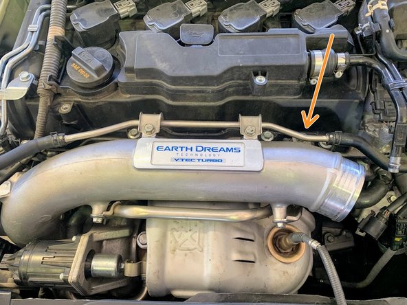 Undo 10 mm bolt on the inlet pipe  as shown