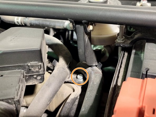 If Front Strut Tower Bar is installed, remove it