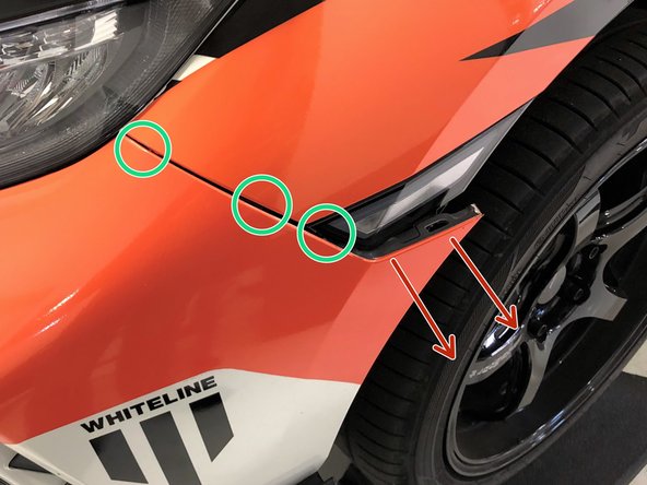 Starting at the corner of the bumper, pull outward until the corner pops free from the fender