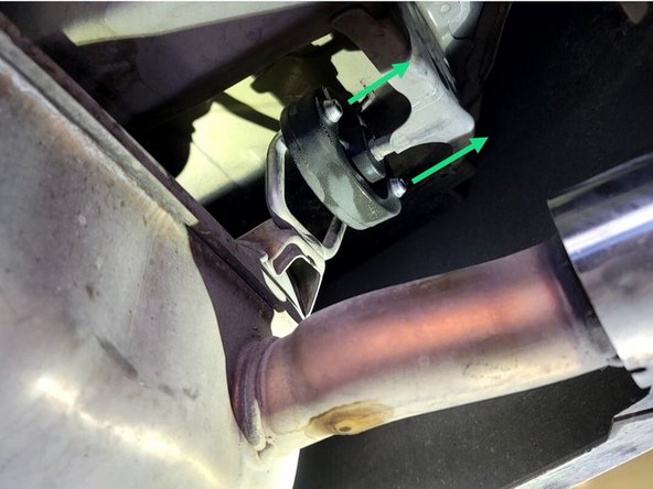 Using a spray cleaner, lubricate the rear hangers and rubber supports