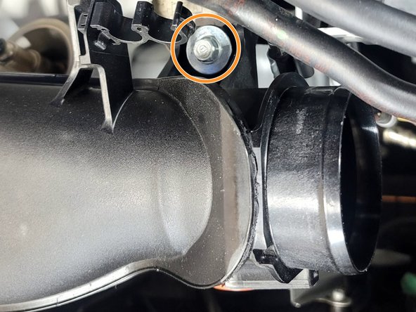 Use 10mm socket and ratchet to remove bolt from TIP bracket near inlet