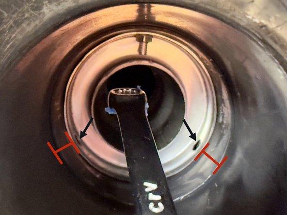 Guide wrench into exhaust tip and align with top Allen bolt. Tighten just enough for the nut to catch on the Allen bolt. Remove wrench and repeat with second and third Allen bolts.