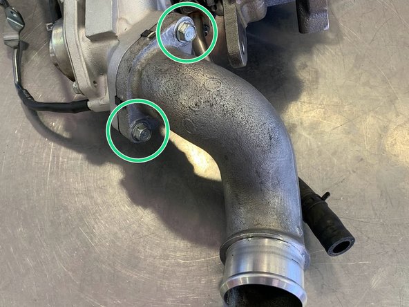 Position the Compressor Cover Outlet Pipe as shown