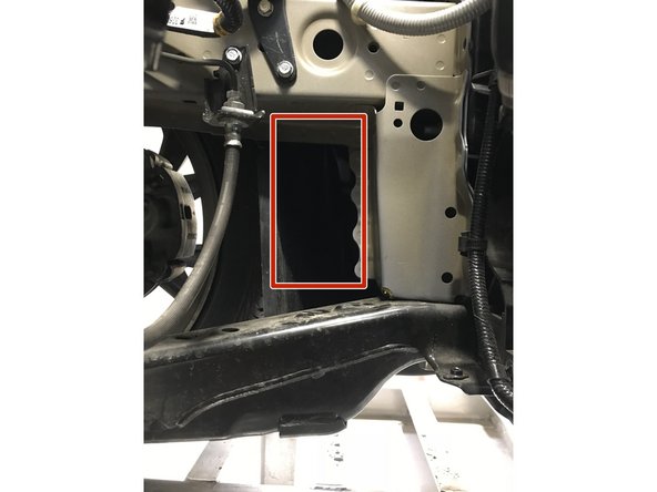 The red square shows where the lower inlet of the airbox will sit in the engine bay and fender well