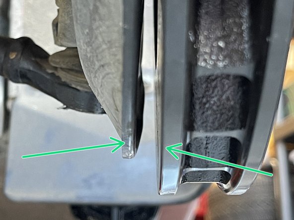 Use the (2) OEM Philips retaining screws secure the rotor as shown