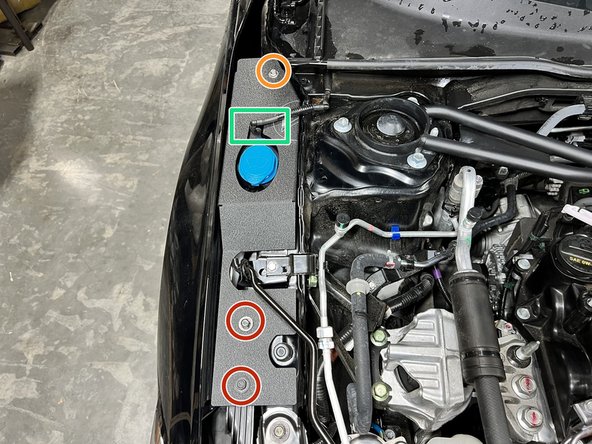 Place passenger side shroud as shown