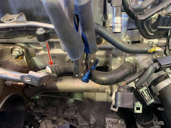 A small amount of water and coolant will spill out. Prepare the area with paper towels