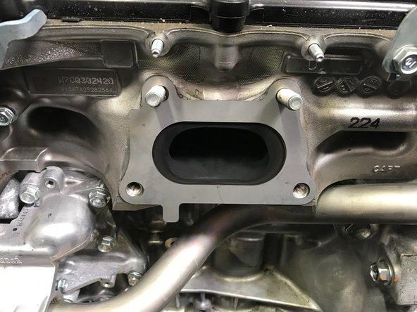 Locate the provided turbine inlet gasket and install as shown