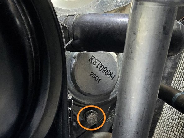 Use a 10mm wrench to remove the three bolts securing the OE BPV to the turbocharger