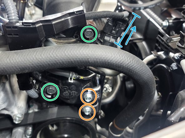 Use 10mm socket and ratchet to remove two (2) bolts from vacuum bracket