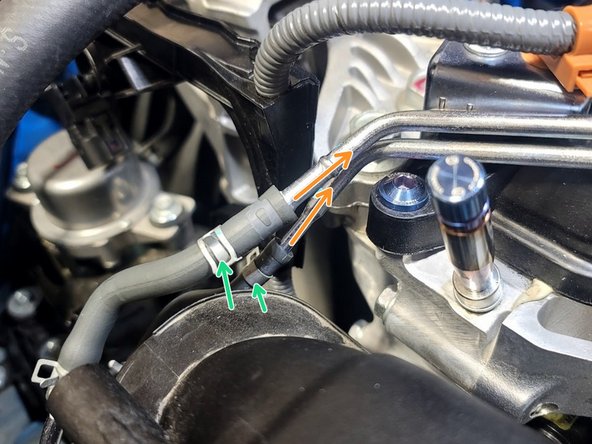 Slide both rubber vacuum lines over hard lines