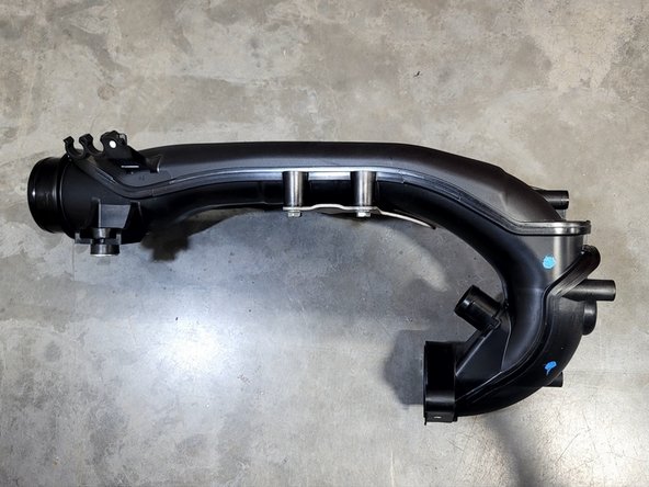 Plug coolant line attached to TIP with finger while removing TIP so as to avoid further coolant spills