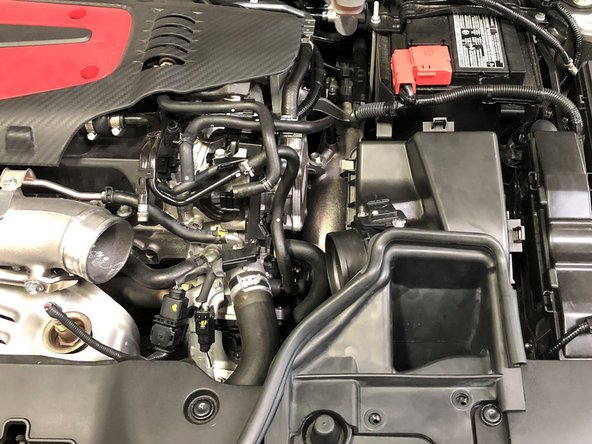 This breather pipe is secured with a permanent OEM clamp. This clamp cannot be removed easily so the pipe will need to be pulled free without removing the clamp. This can be difficult the first time. This permanent clamp will be replaced with the provided regular hose clamp during re-installation