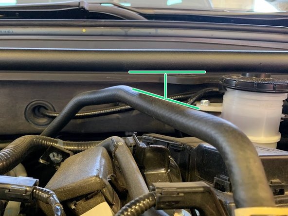 If the cables are pushing into the strut bar, adjust the cables by flexing them toward the front of the car a bit to create clearance
