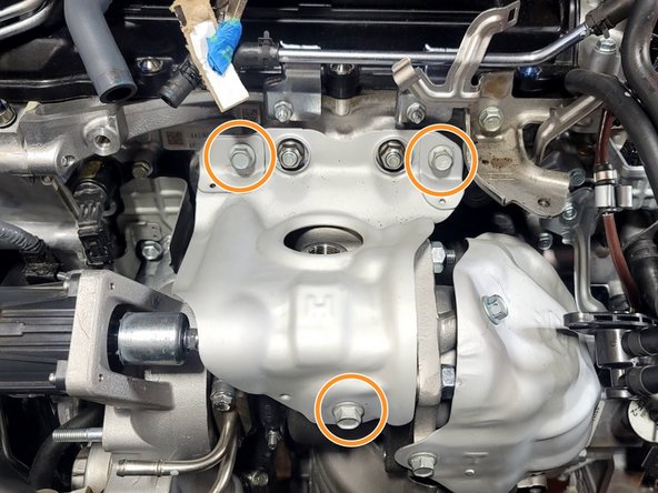 Reconnect three (3) bolts with 12mm socket and ratchet. Torque to 15-18 ft-lbs