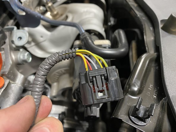 With the loop tab loose, slide the cover off