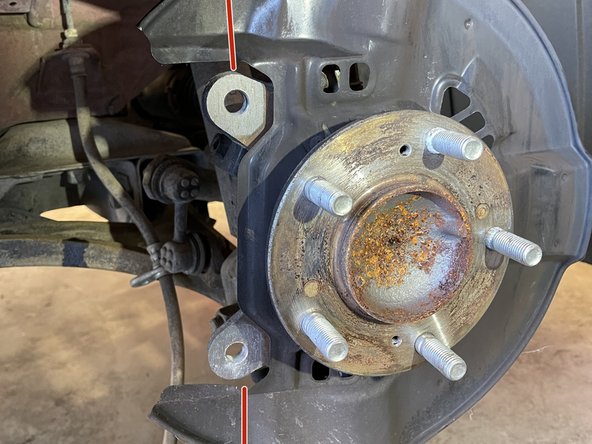 Trimming of brake dust shields is required to accommodate the caliper brake bracket