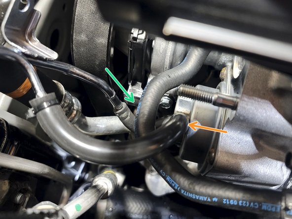 Route new silicone hose over Bypass Valve barb as shown