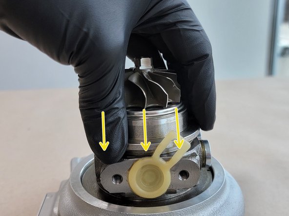 Using both hands press the CHRA into the cover. Ensure this goes in straight