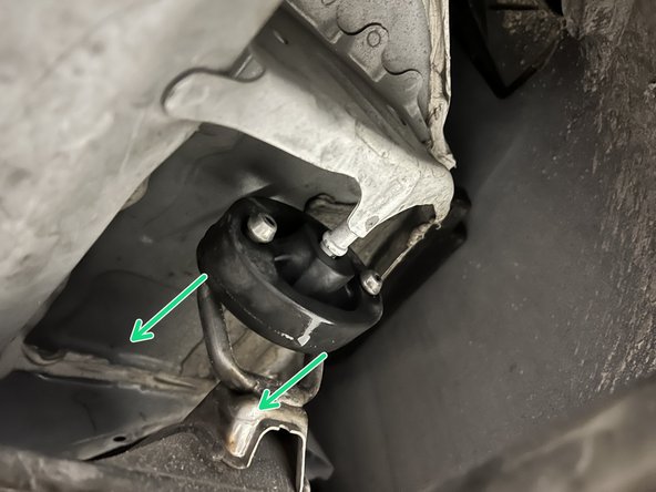 Using a spray cleaner, lubricate the rear hangers and rubber supports