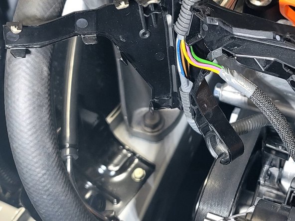 Open wire cover and remove from car