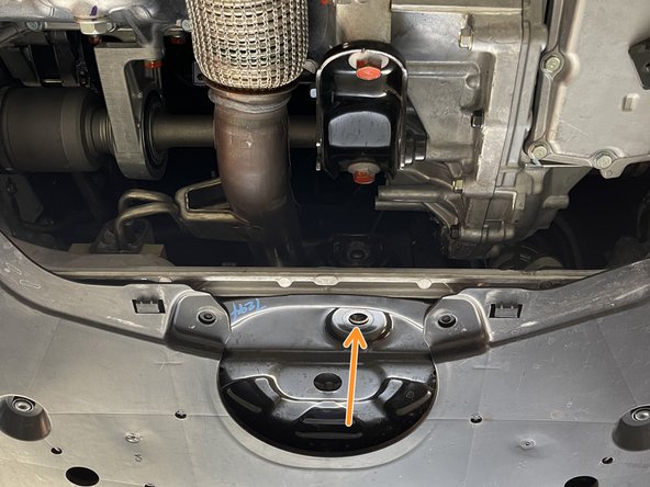 Use one hand to lift the frontpipe when removing the front bolt