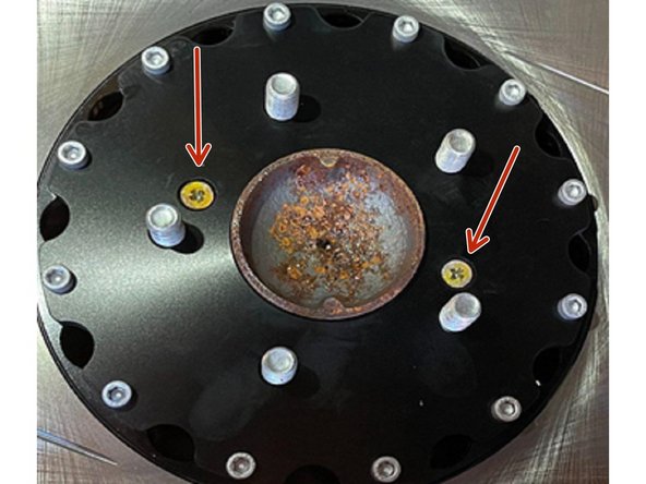 Install the rotor by reusing the OEM Phillips screws in the chamfered holes on the rotor as shown