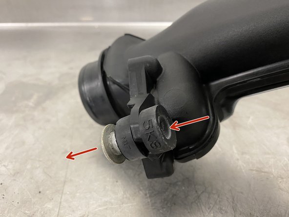 Press the silver metal collar out first