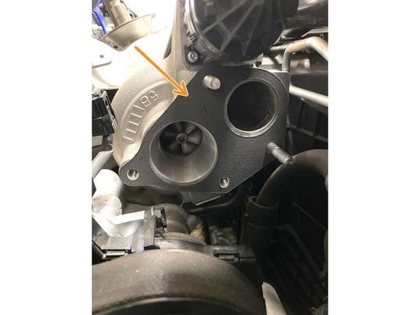 Install the gasket on the compressor face as shown