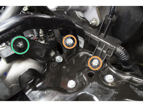 Reinstall the two 10mm bolts