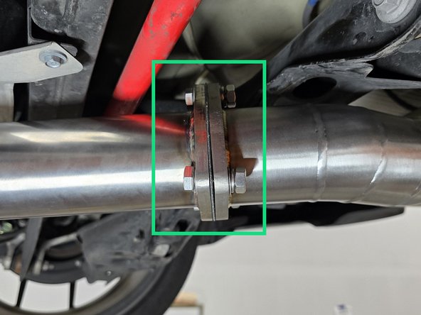 Using gasket and provided hardware, Loosely connect the forward mid pipe and the rearward mid pipe
