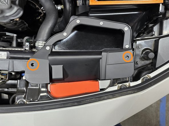 Align the mounting holes on the airbox inlet with the threaded holes as shown