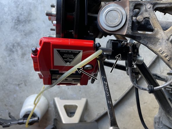 Have the person in the driver's seat press the brake pedal 3-5 times until there is sufficient pedal pressure. Then, have them hold the brake pedal firmly as the bleed screw is loosened. The pedal will go to the floor while fluid and air will enter the bottle. Make sure your friend holds the pedal down as you retighten the bleed screw