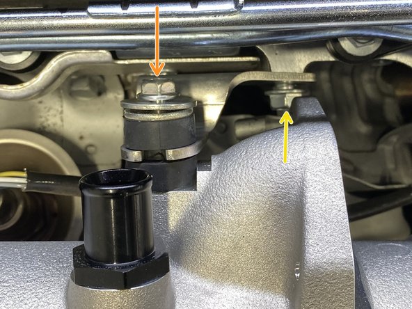 Hand thread the OE TIP bolt through the isolator into the 27WON TIP