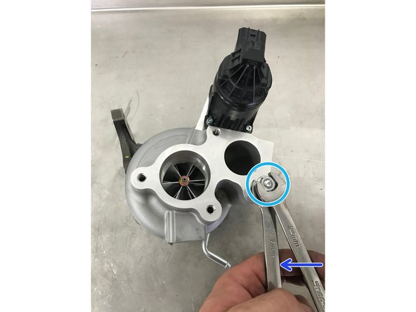 Use a 13mm and 12mm wrench to tighten the two nuts onto each other