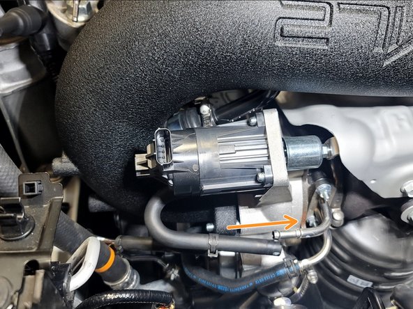 Use pliers and OE clamp to resecure lower rubber coolant feed line to turbocharger