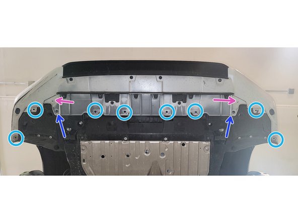 Use a large flathead screwdriver or prying tool to remove the ten (10) push-clips on the bottom of the bumper