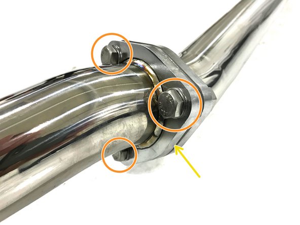 Install the provided tri-bolt gasket