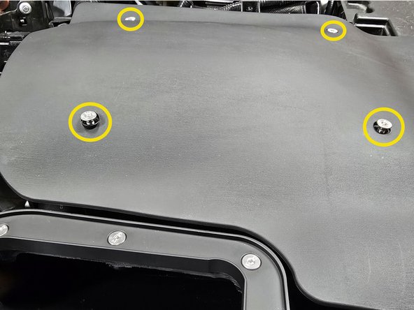 Slight pushing to align the holes is ok. You should not have to apply a lot of force to get the shroud to align with the box