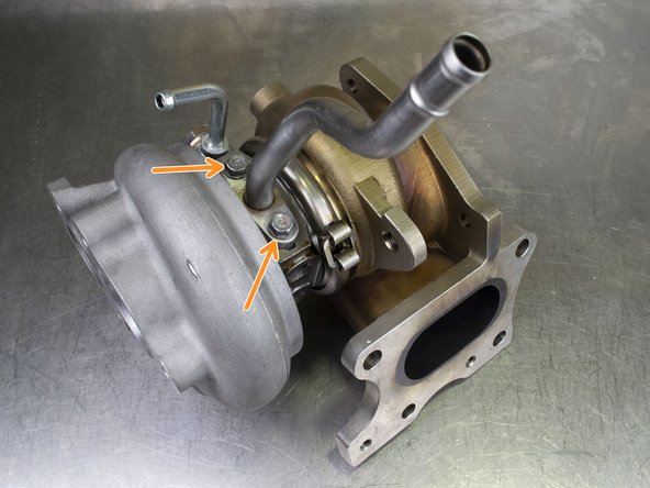 Locate the OE oil drain pipe and OE oil drain pipe gasket