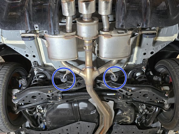 Use a spray cleaner to lubricate the rear hangers and rubber supports