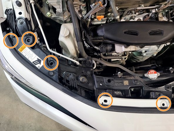 Reinstall the ten (10) push-clips on the top of the bumper