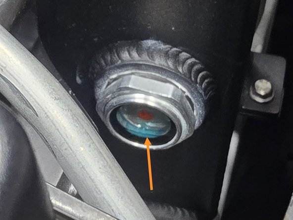 Keep an eye out for any coolant spills while filling the tank and promptly clean them up