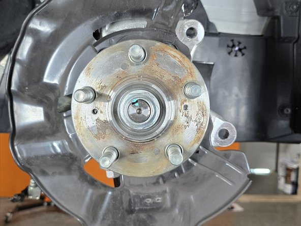 With retention screw removed, slide the rotor outward off the wheel studs