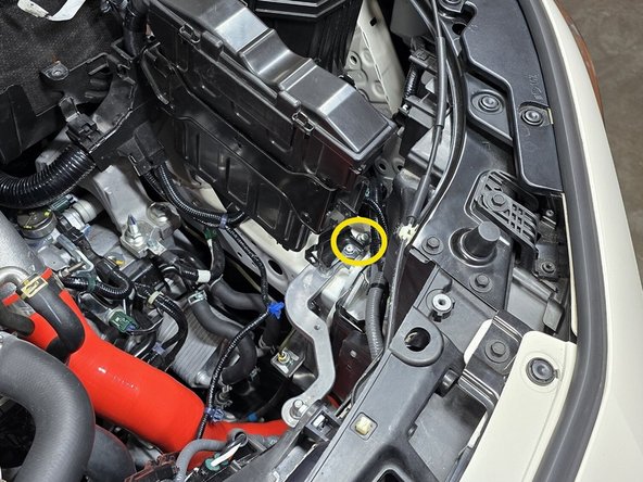 This will come from the upper or lower airbox mounting bushing from Step 5