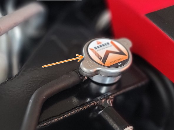 Wipe clean OEM radiator cap and dry