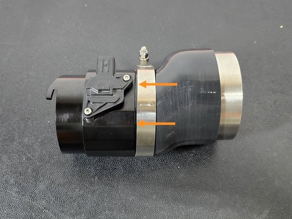 Install the filter silicone onto the MAF housing with the 92-100mm clamp over the silicone as shown